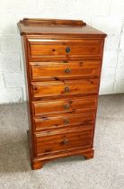 A modern varnished pine chest of six drawers, 103cm high, 45cm wide; and a small corner cabinet (2)