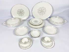 A Royal Worcester bone china ‘Bridal Lace’ pattern part dinner service, including two covered
