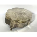 A silver trinket box, with serpentine shaped hinged lid, hallmarked Birmingham 1920, one foot