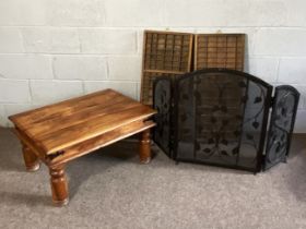 A modern hardwood coffee table, with turned legs; also a three fold fire guard, with leaf