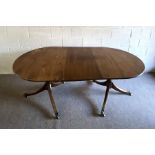 A George III style mahogany extending dining table, late 19th century, with two D-ends and a