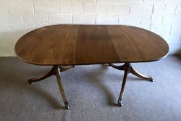 A George III style mahogany extending dining table, late 19th century, with two D-ends and a