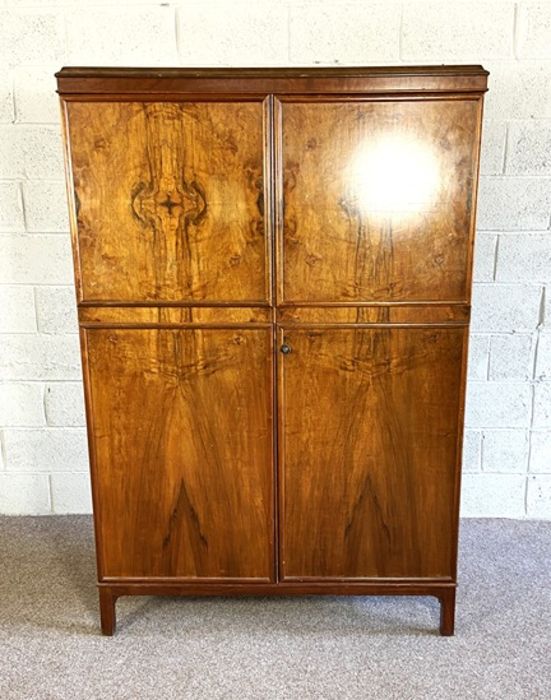 A modern bow-front double wardrobe, with moulded cornice, 20th century