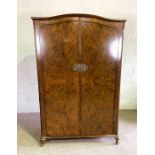 A burr walnut veneered double wardrobe, mid 20th century, together with a dressing table (2)