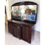 A modern breakfront varnished sideboard with large arched mirrored, set over a drawer and three