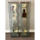 Two modern glass tower cabinets, each with three square glass shelves and mirrored backs, 163cm
