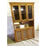 A large modern dresser/display cabinet, circa 2000, Colonial style, with faux bamboo moulding, the