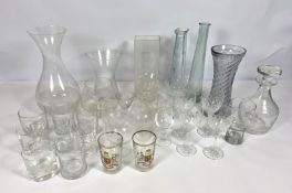 A large assortment of glassware, including a decanter, various vases, assorted tumblers etc. (a