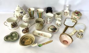A large assortment of decorative ceramics, including a Elizabeth II crested bell, assorted jugs,