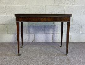 A Regency mahogany tea table, early 19th century, with fold-over top and set on four tapered legs,