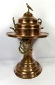 A large copper and brass Islamic incense burner, late 19th or early 20th century, with a pierced