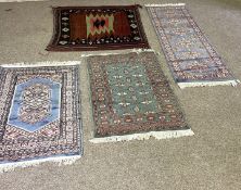 A small modern runner, with six guls on a light blue ground, 190cm long; also three other small rugs