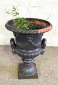 A cast iron classical garden Campana urn, decorated with swags, 61cm high; and another smaller (2)