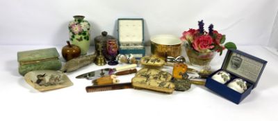 An assortment of decorative items, including a vintage articulated fish; a Cloissone vase;