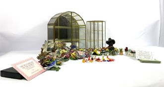 Two collectors glass display cases, each containing porcelain flowers or butterflies (Franklin
