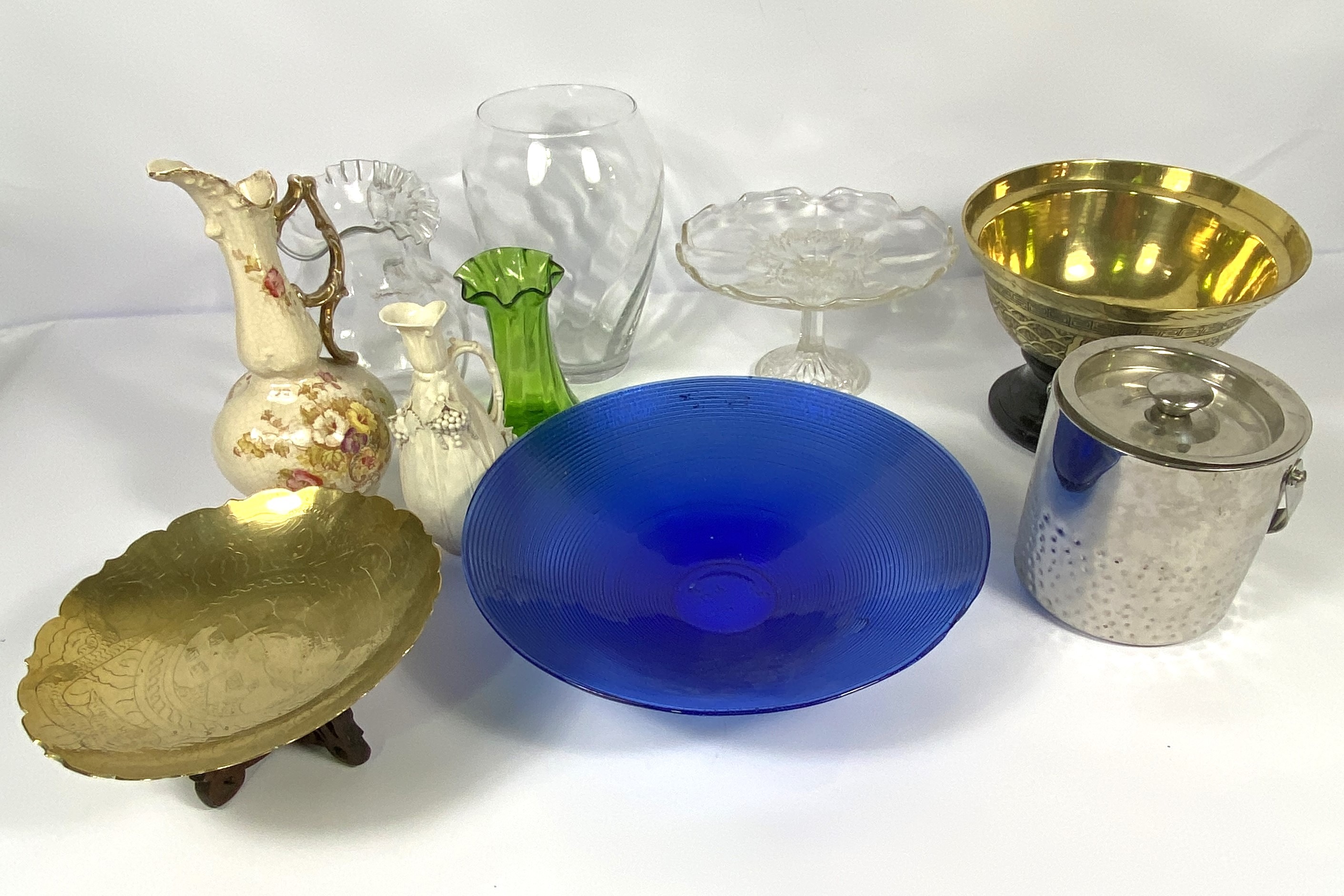 An assortment including a large blue glass bowl, a Chinese style brass bowl, three jugs, a cased set