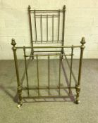 A late Victorian single brass bed frame, with turned finial and iron supports, 90cm wide, 188cm