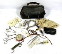 A vintage leather Doctor or Midwife’s bag, mid 20th century, containing an assortment of surgical