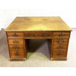 A late Victorian oak partners desk, with a deep plan oak top, one side with three drawers over