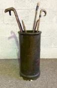 A vintage stoneware decorated chimney pot umbrella stand, painted with berries; also a group of