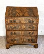 A George III style mahogany bureau, early 20th century, with fall front and fitted interior, 102cm
