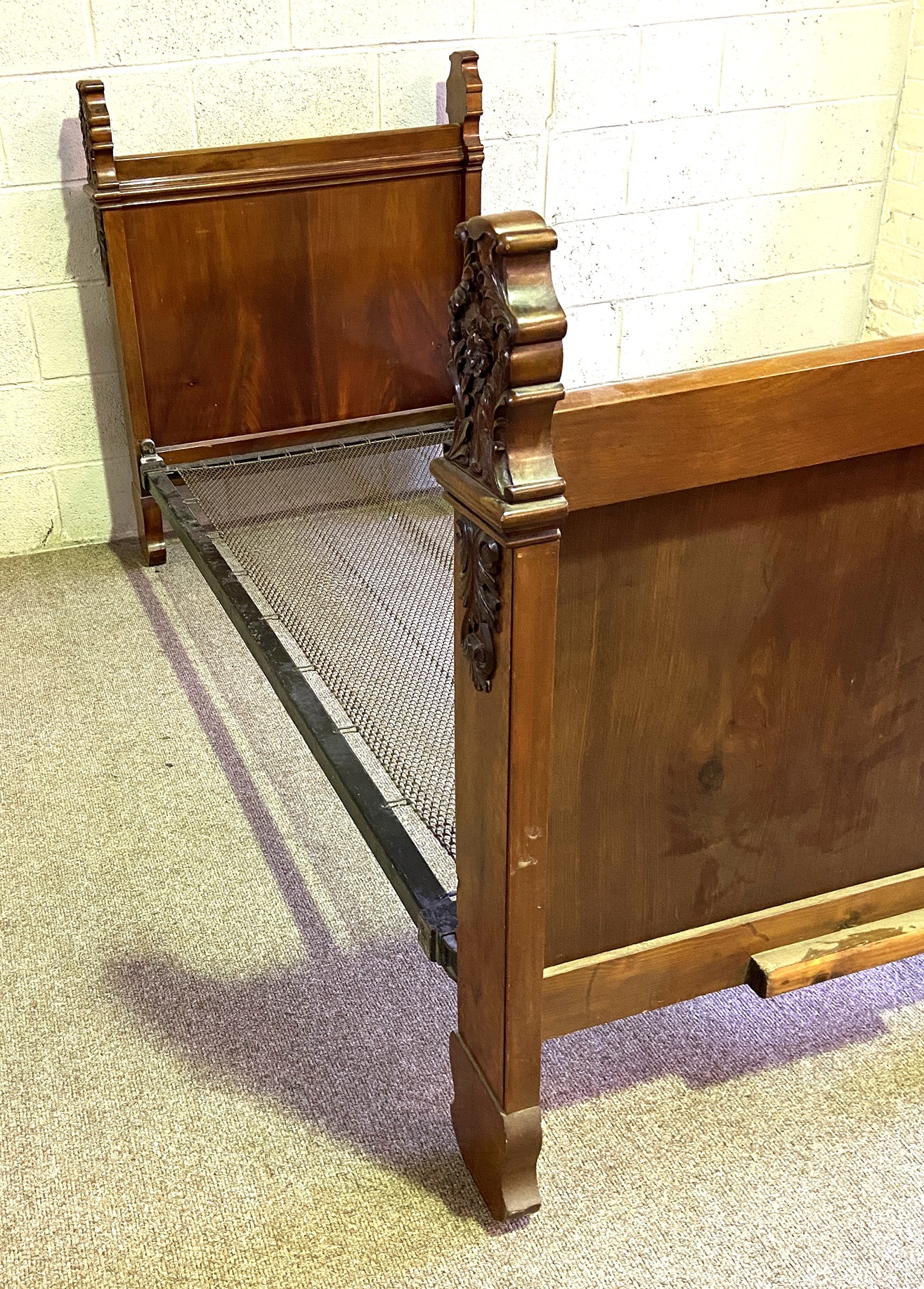 A 19th century mahogany single bed, with acanthus and flower carved finials, panelled ends and a - Image 3 of 6