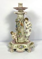 A Dresden candelabra, in the manner of Meissen, the Ionic order classical column with figures of