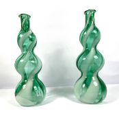 A pair of Empoli Region vintage glass ”Genie’ bottles, circa 1970, with white and green striated and