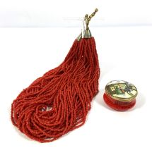 A vintage coral sautoir necklace, 20th century, with multiple strands of coral beads, 43cm long, and