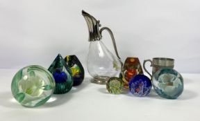 Seven assorted glass paperweights, including a Caithness Pyramid, and assorted flower inset