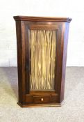A 19th century glass fronted corner cabinet, with single drawer. 176cm high, 75cm wide