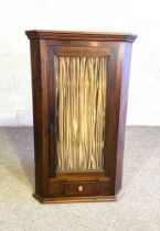 A 19th century glass fronted corner cabinet, with single drawer. 176cm high, 75cm wide