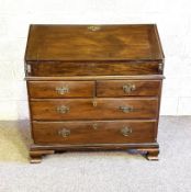 A George III mahogany bureau, mid 18th century, with a fall front, opening to a fitted interior,