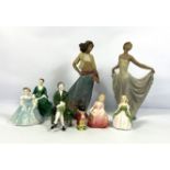 Two LLadro figures of dancing Spanish ladies, decorated in colours; also Royal Doulton figure `