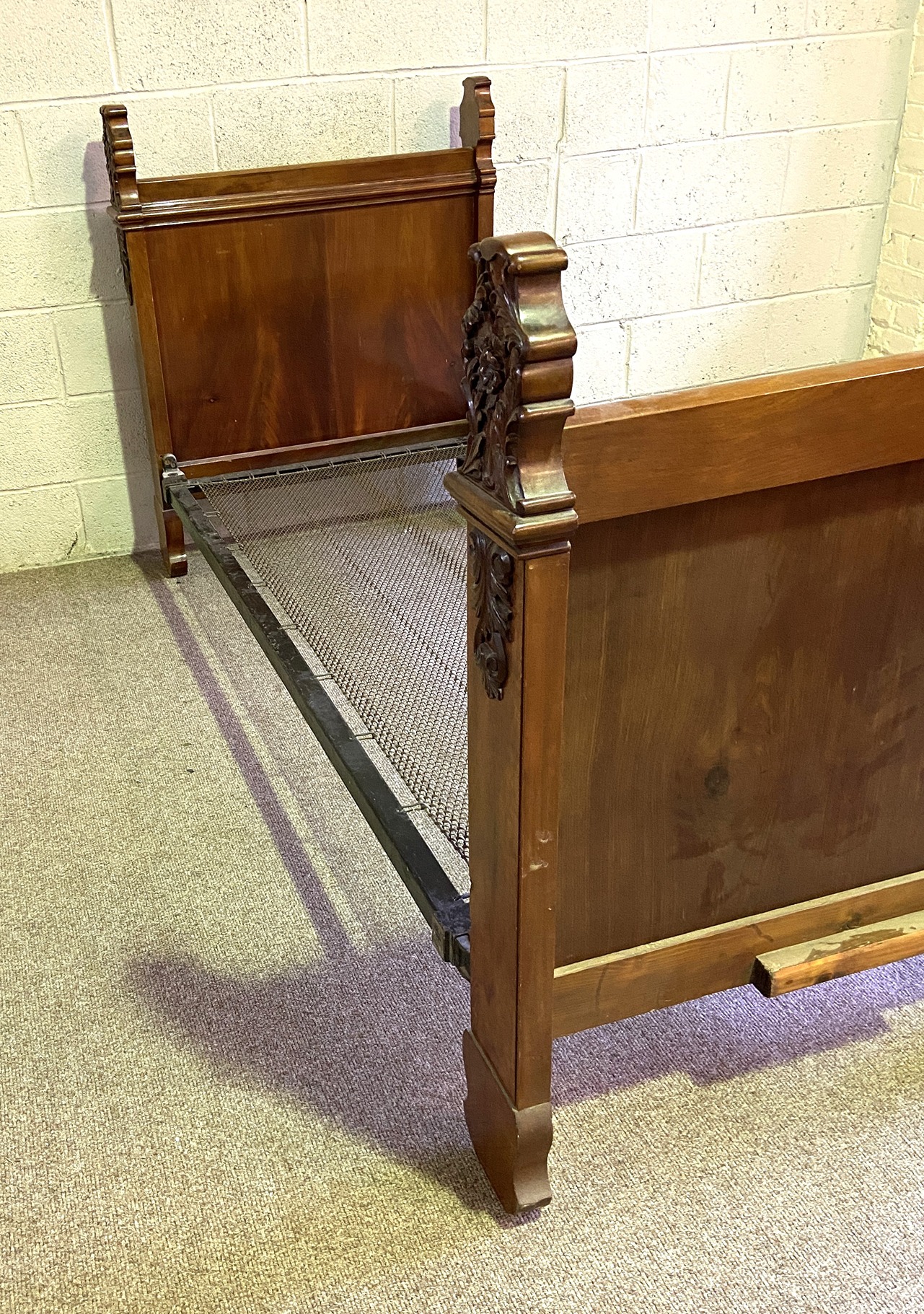 A 19th century mahogany single bed, with acanthus and flower carved finials, panelled ends and a - Image 6 of 6
