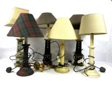 Seven modern table lamps, including three with stepped pillar bases, one with marbled effect, all