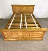 A Contemporary 5 foot hardwood and stone parquetry decorated double bed, with a decorative