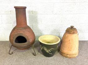A terracotta garden Chiminea, with stand, 80cm high (plus stand); A vintage terracotta Rhubarb