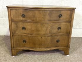 A George III style serpentine chest of three drawers, 98cm wide