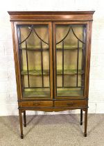 An Edwardian satinwood banded china display cabinet, with two glazed doors, over two short