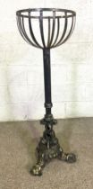 A wrought and cast iron garden jardiniere stand