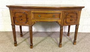 A George III style bow fronted sideboard, 20th century, 83cm high, 138cm wide