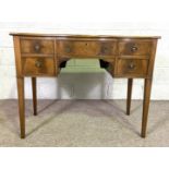 A George III style mahogany serpentine fronted serving table, early 20th century, with five