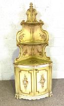 A French Louis XVI style painted corner cabinet, 20th century, with shaped open shelves over a bow