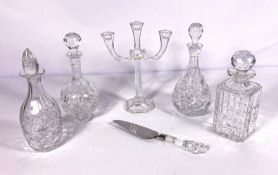 Four assorted moulded crystal glass decanters, including a square spirit decanter with ball