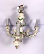 A Meissen style pendant three light chandelier fitting, with scrolled and decorated arms and a