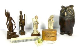 A selection of ornaments, including a carved wooden owl, two 'piano' figures, a faux ivory fan and a