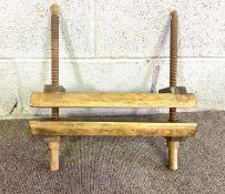 A vintage pine press, with turned wood screws and pine press blocks