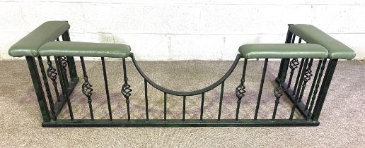 A vintage wrought iron club fender, with padded top and forged iron uprights, including half moon
