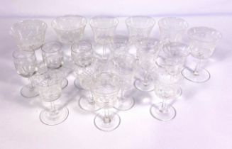 A large assortment of table glassware, including various sets of wine glasses and a modern